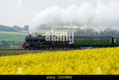 LMS Jubilee Class steam locomotive no.45690 'Leander', pulls carriages from Alresford towards Ropley, on the second day of the Spring Steam Gala on the Mid Hants Railway, also known as the Watercress line, in Hampshire. Picture date: Saturday April 27, 2024. Stock Photo