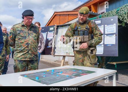 27 April 2024, Hesse, Alsfeld: Bundeswehr soldiers sit in an armored ...