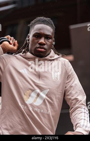 Calvin Bassey of Fulham arrives ahead of the Premier League match between Fulham and Crystal Palace at Craven Cottage, London, England on 27 April 2024. Photo by Grant Winter. Editorial use only, license required for commercial use. No use in betting, games or a single club/league/player publications. Credit: UK Sports Pics Ltd/Alamy Live News Stock Photo
