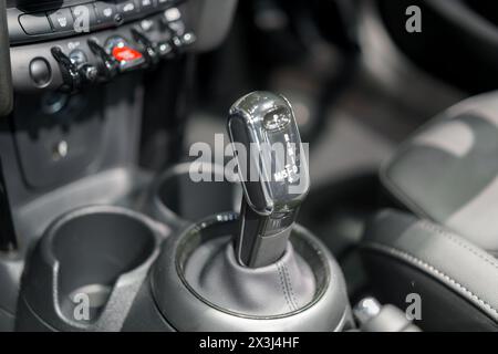 modern car's automatic gearbox and control buttons. This detailed shot captures the precision engineering and ergonomic design, showcasing the intuiti Stock Photo