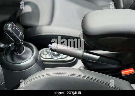 modern car's automatic gearbox and control buttons. This detailed shot captures the precision engineering and ergonomic design, showcasing the intuiti Stock Photo