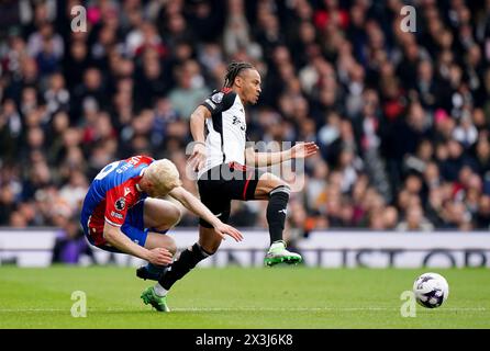 Crystal Palace's Will Hughes (left) and Fulham's Bobby De Cordova-Reid battle for the ball during the Premier League match at Craven Cottage, London. Picture date: Saturday April 27, 2024. Stock Photo