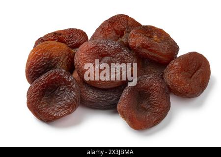 Heap of natural unsulphured sun dried brown Turkish apricots fruit close up isolated on white background Stock Photo