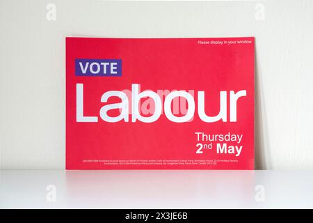 Red Vote Labour notice card / poster/ placard / sign distributed in the run up to the Local Council elections in England on Thursday 2nd May 2024 Stock Photo
