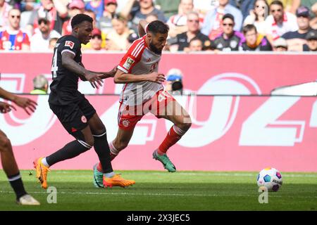 Munich, Germany. 27th Apr, 2024. MUNICH, GERMANY - APRIL 27: Aurelio Buta of Eintracht Frankfurt and Noussair Mazraoui of Bayern Muenchen during the Bundesliga match between FC Bayern Muenchen and Eintracht Frankfurt at Allianz Arena on April 27, 2024 in Munich, Germany.240427 SEPA 24 030 - 20240427 PD6363 Credit: APA-PictureDesk/Alamy Live News Stock Photo