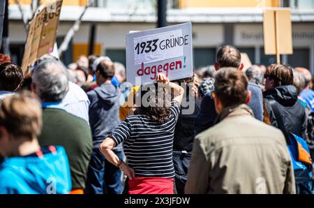 Donaueschingen, Germany, 27th Apr 2024: A woman holds up a sign that says there are 1933 reasons against the AfD. (Photo by Jonas Philippe/dieBildmanufaktur) Credit: dieBildmanufaktur/Alamy Live News Stock Photo