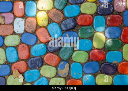 Colorful pebbles placed in the ground Stock Photo