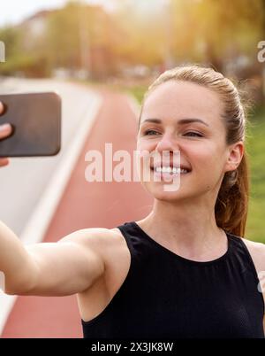 Beautiful brunette woman doing selfie in the car Stock Photo - Alamy