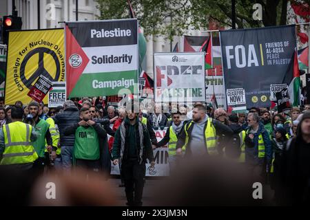 London, UK. 27th April, 2024. A mass Pro-Palestine protest, calling for a Ceasefire Now and to Stop Arming Israel marches through Waterloo Place. Starting from Parliament Square towards Hyde Park, the marchers, in their thousands, continue to respond to the Israeli assault in Gaza. Credit: Guy Corbishley/Alamy Live News Stock Photo
