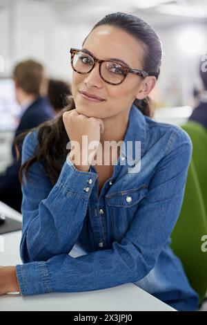 Portrait, woman and office with smile, creative and thinking for workplace, decision and business in startup. Female person, programmer and Stock Photo