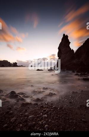 Sunset between the rocks at low tide on the shore of Playa del Silencio, Asturias III , Spain Stock Photo