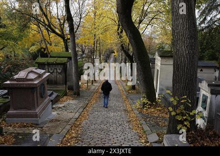 Paris, France, November 11, 2023. A visitor walks in the Pere-Lachaise cemetery. ©Isabella De Maddalena/opale.photo Stock Photo
