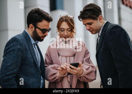 Young entrepreneurs discussing project strategies in urban setting Stock Photo