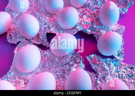 White Easter egg with colorful ultraviolet holographic neon lights. Creative concept. Stock Photo