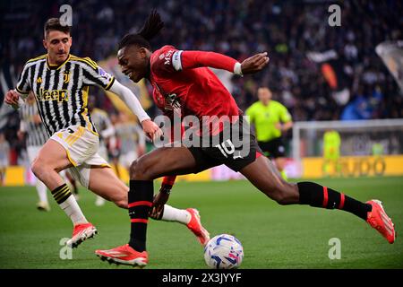 Torino, Italia. 27th Apr, 2024. Andrea Cambiaso (Juventus FC); and Rafael Leao (AC Milan); in action during the Serie A soccer match between Juventus and Milan at the Allianz Stadium in Torino, north west Italy - Saturday, April 27, 2024. Sport - Soccer . (Photo by Marco Alpozzi/Lapresse) Credit: LaPresse/Alamy Live News Stock Photo