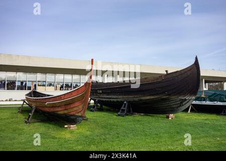 ROSKILDE, DENMARK - OCTOBER 30, 2014: Two ships in front of Viking Ship Museum in Roskilde, Denmark Stock Photo