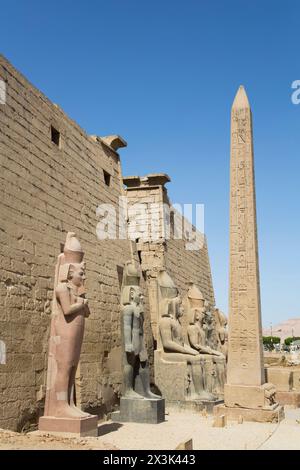 Colossi of Ramses II in Front of Pylon, Obelisk, Luxor Temple, UNESCO World Heritage Site, Luxor, Egypt Stock Photo