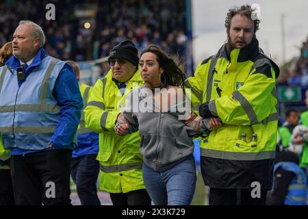 Sheffield, UK. 27th Apr, 2024. Pitch Invader escorted off the pitch during the Sheffield Wednesday FC v West Bromwich Albion FC sky bet EFL Championship match at Hillsborough Stadium, Sheffield, England, United Kingdom on 27 April 2024 Credit: Every Second Media/Alamy Live News Stock Photo