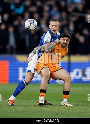 Ipswich Town's Luke Woolfenden, Left, Looks To Pass The Ball Under ...