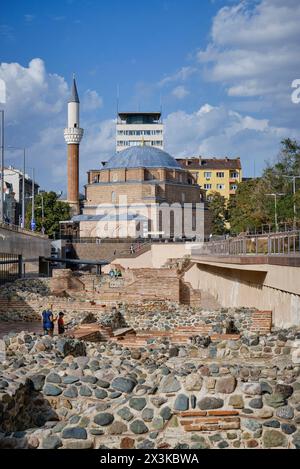 Bulgaria, Sofia, people at the ancient Serdika roman ruins downtown and the Banja Baši Mosque in the background Stock Photo