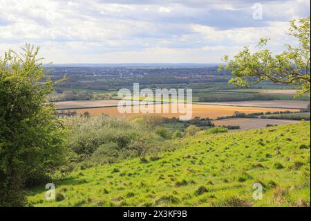 View over farmland near Wye, from the North Downs, in spring sunshine, near Ashford, Kent, UK Stock Photo