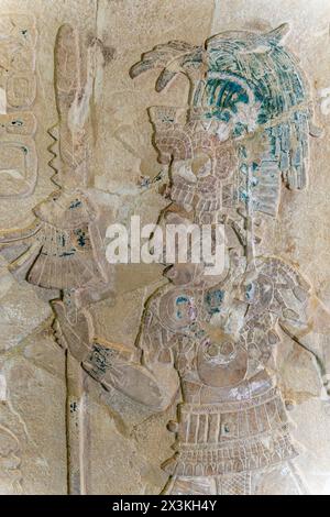 Mayan bas relief carving in stele tombstone of Mayan ruler king with staff of power, Palenque, Mexico. Stock Photo