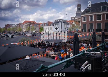 April 27, 2024: Leiden, Netherlands, Canals party celebration the birthday of the King in Netherlands, National holiday King’s Day or Koningsdag in Du Stock Photo