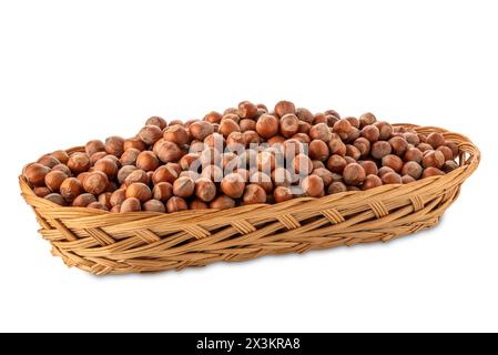 Hazelnuts in wicker basket isolated on white with clipping path included Stock Photo