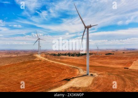 Giant windmill turbines generating electricity in remote South Australian outback. Stock Photo