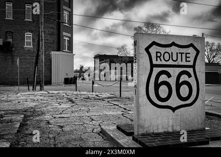 A Route 66 sign on the historic route through the little town of Carterville, Missouri. Stock Photo