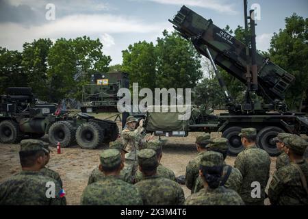 U.S. Army 1st Lt. Christian de Jong, Bravo Battery, 1-1 Air Defense Artillery, 38th Air Defense Brigade, teaches members of the Philippine Army about the MIM-104 Patriot System as part of the Joint Integrated Air And Missile Defense exchange during Exercise Balikatan 24 at Clark Air Base, Philippines, April 25, 2024. BK 24 is an annual exercise between the Armed Forces of the Philippines and the U.S. military designed to strengthen bilateral interoperability, capabilities, trust, and cooperation built over decades of shared experiences. (U.S. Army photo by Maj. Trevor Wild) Stock Photo