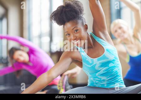 Black woman, portrait and yoga class trainer for stretching, yogi instructor and exercise on mat. Female person, confident and pilates for spiritual Stock Photo