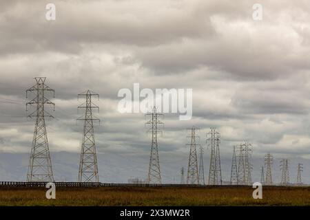 High Voltage Power Lines with Storm Clouds Approaching. Palo Alto Baylands, Bay Area, California. Stock Photo