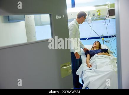 In vitro fertilization (IVF). Couple having appointment with doctor in ...