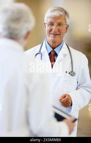 Doctors with stethoscope and tablet in corridor, Onkologikoa Hospital, Oncology Institute, Case Center for prevention, diagnosis and treatment of canc Stock Photo