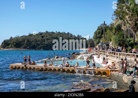 Fairy Bower ocean rockpool beside the scenic walkway between Manly Beach and Shelly beach,Sydney,NSW,Australia people swim on hot autumn day Stock Photo