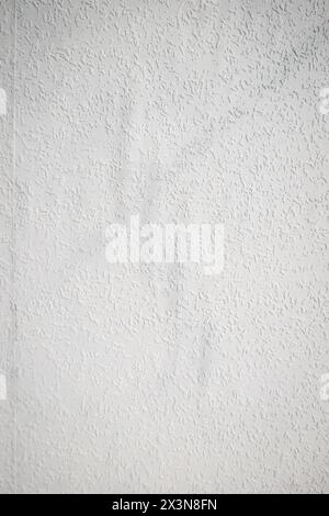 grey painted woodchip wallpaper texture pattern backgroung. Stock Photo