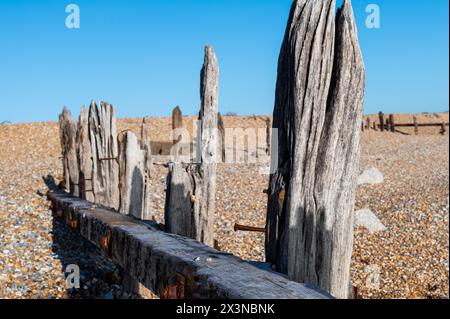 Old wooden sea defences at Rye Harbour Nature Reserve, East Sussex, England Stock Photo