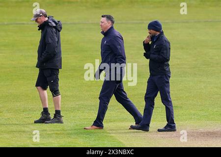 Bristol, UK, 28 April 2024. Umpires Neil Pratt and Surendiran Shanmugam inspect the pitch during the Vitality County Championship Division Two match between Gloucestershire and Middlesex. Credit: Robbie Stephenson/Gloucestershire Cricket/Alamy Live News Stock Photo