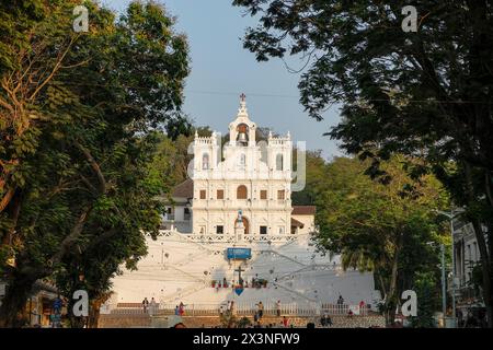 Panaji, India - February 3, 2024: People walking in front of the Our Lady of the Immaculate Conception Church in Panaji, Goa, India. Stock Photo