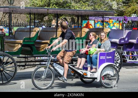 New Orleans, Louisiana. French Quarter, Tourists in a Tricycle Carriage City Tour. Stock Photo