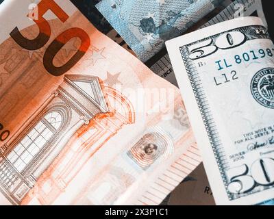 Economic Exchange. Two major world currencies, the Euro and Dollar, depicted in a close-up shot. Stock Photo