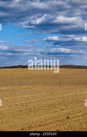 A clear day over freshly tilled agricultural land. Stock Photo