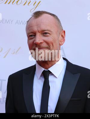Dublin, Ireland. 20th April 2024.  Richard Dormer arriving on the red carpet at the Irish Film and Television Awards (IFTA), Dublin Royal Convention Centre. Credit: Doreen Kennedy/Alamy Live News. Stock Photo