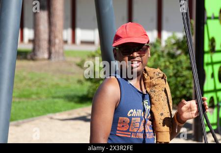 Uppsala, Sweden - August 14, 2023: young man with mental difficulties on the playground Stock Photo