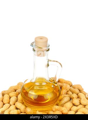 Peanut oil in a glass bottle with peanuts. Free space for text. Stock Photo