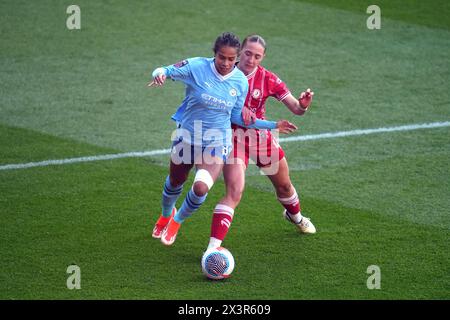 Manchester City's Mary Fowler (left) and Bristol City's Naomi Layzell battle for the ball during the Barclays Women's Super League match at Ashton Gate, Bristol. Picture date: Sunday April 28, 2024. Stock Photo