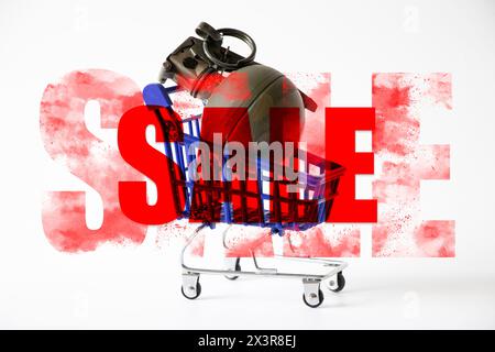 A hand grenade lies in a shopping cart on a white background and the text sale, arms trade, gun store and business Stock Photo
