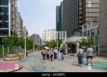 April 28, 2024, Seoul, South Korea: People walk on Seoullo 7017, a Linear Park in Seoul. Seoullo 7017, also known as the Seoul Skygarden or Skypark, is an elevated, linear park in Seoul, built on top a former highway overpass. The path, which is about one Kilometre in length and lined with 24,000 plants and was opened in May 2017. The path also improves walking times for people around the city's Central Station. The disused overpass closed in 2015 and cuts diagonally across Seoul Station at 17m above street level. The '70' in the name comes from the year 1970 when the flyover was dedicated, wh Stock Photo