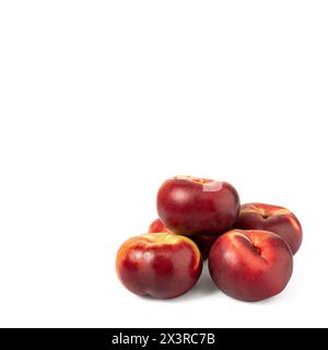 four peaches stacked nectarines and sliced plum fruit isolated on white background. clipping path included.Set of fresh five whole plum fruit isolated Stock Photo